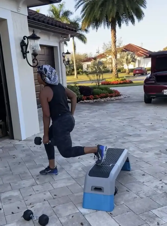 Client performing an outdoor split-squat exercise