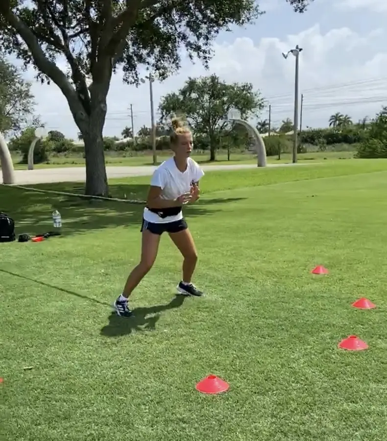 Outdoor agility and conditioning drills on the grass