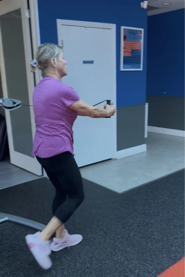 Client practicing balance and coordination in the studio
